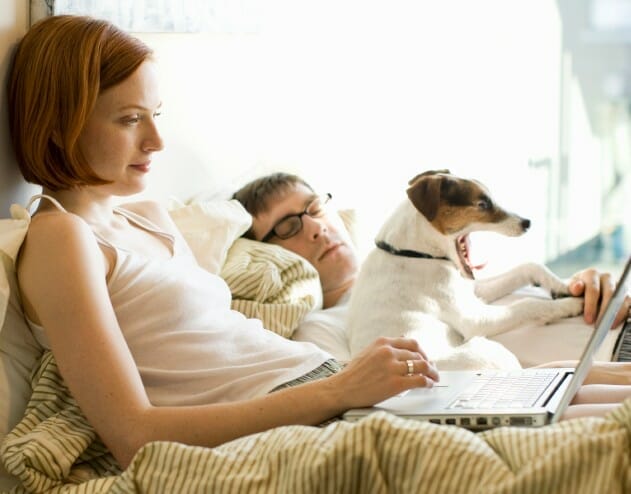 Dog Sleeping In Bed Ruining Relationship? Tips on How to Cope